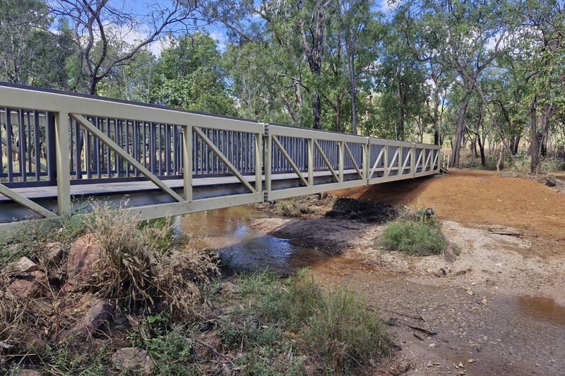 Pedestrian footbridge over water.