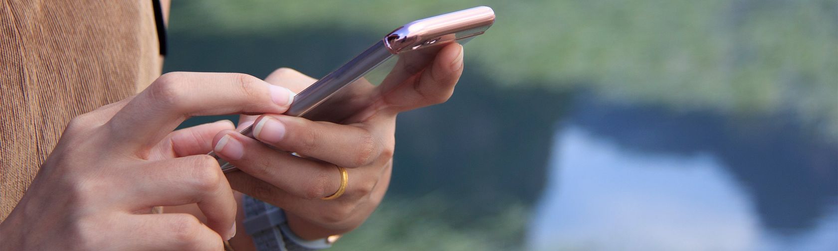 Visitor using mobile phone in Kakadu