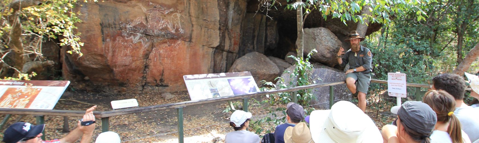A ranger giving a tour of rock art