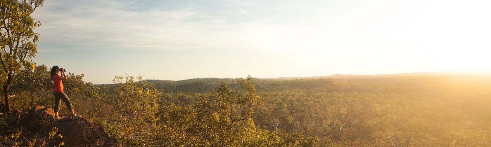 Visitor looking out over Kakadu landscape. Photo: Park Trek