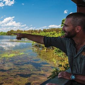 Ranger pointing out birds on the wetlands