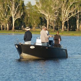 People fishing from a boat. Photo: Grant Williamson