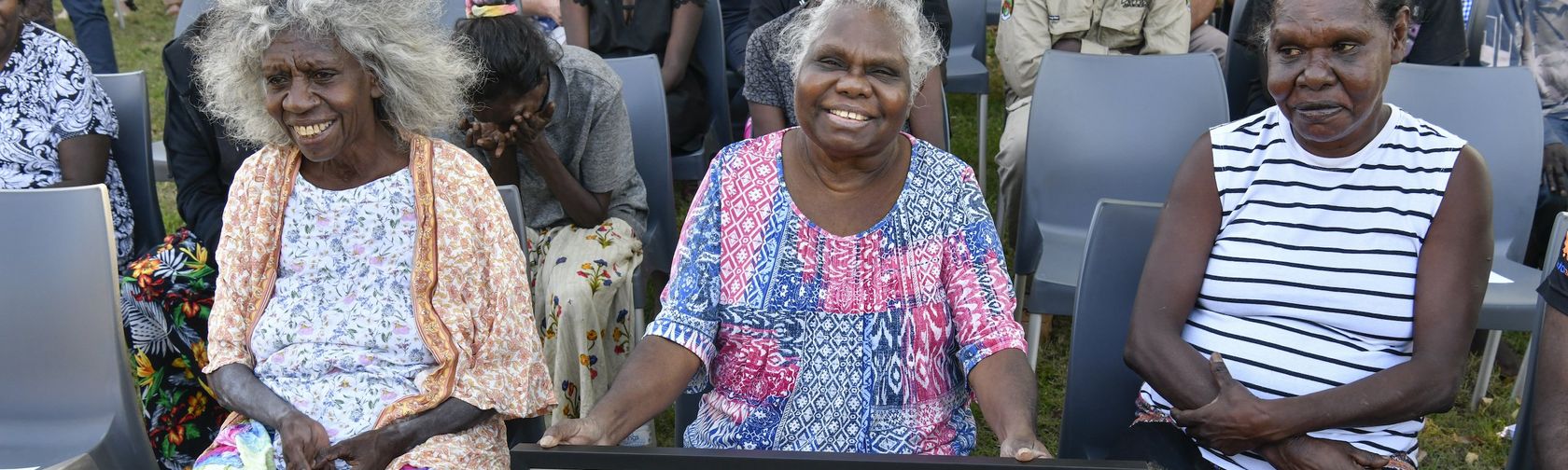 Yvonne Margarula| Senior Mirarr Traditional Owner and Director Gundjeihmi Aboriginal Corporation with her family receiving the township of Jabiru deed of grant. Credit: Steve Strike