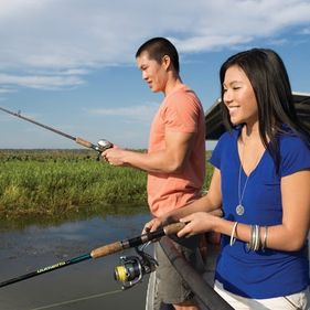 Visitors fishing on Yellow Water wetlands. Credit Tourism NT